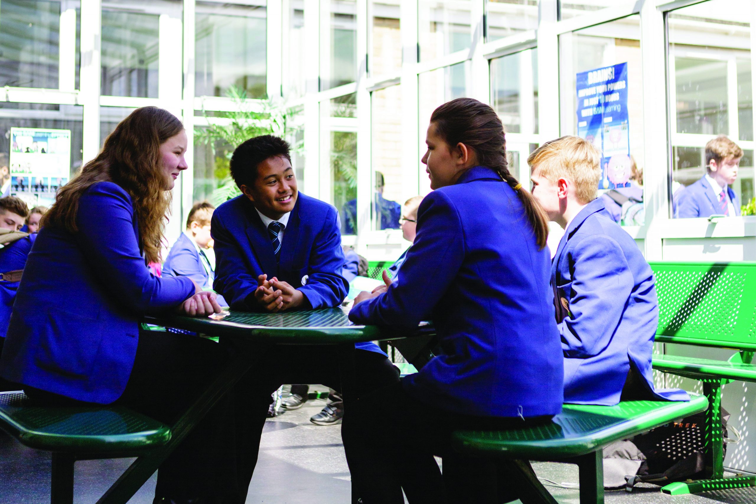 A group of pupils sitting around a table