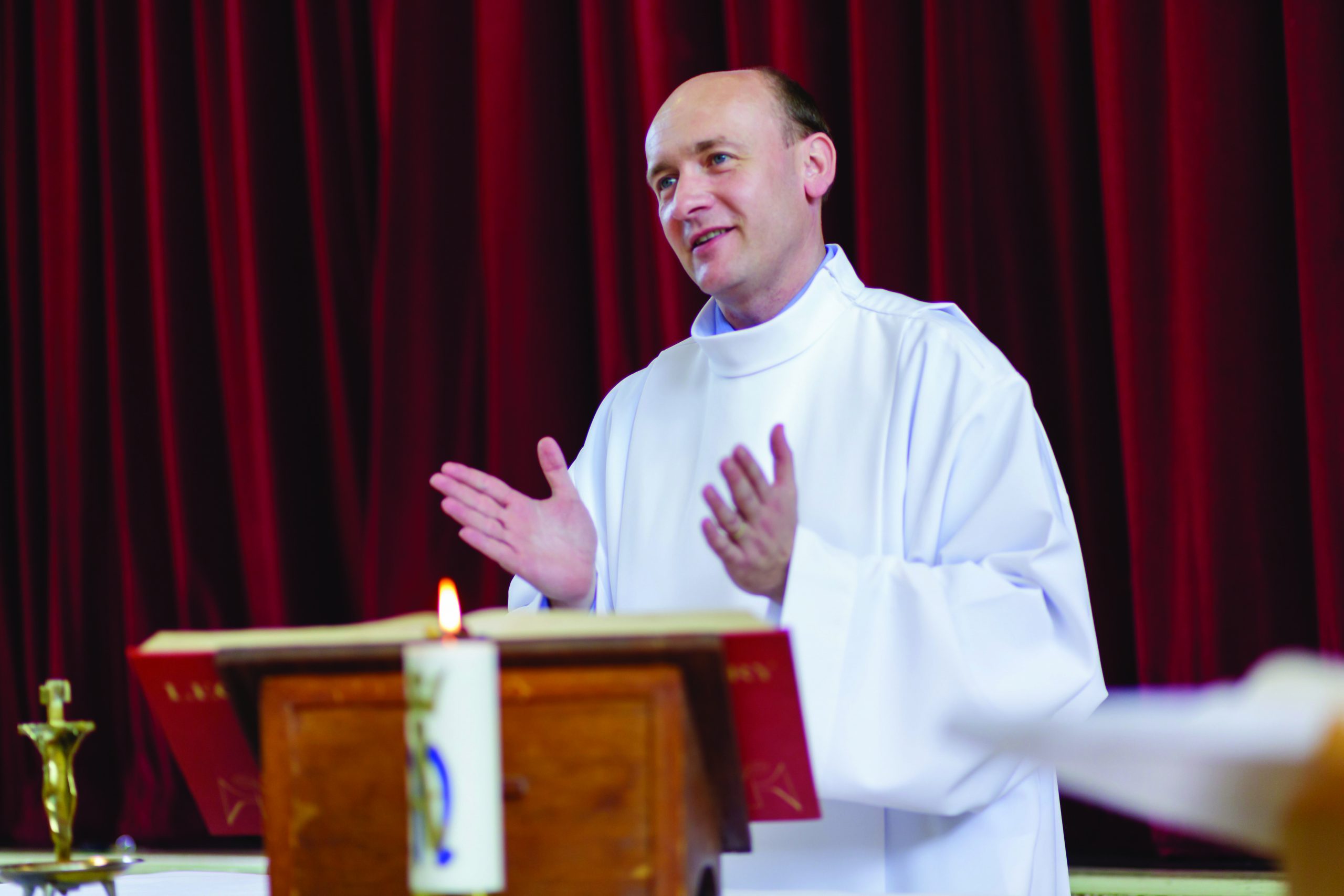 Mr Blaho standing at the lectern in the chapel