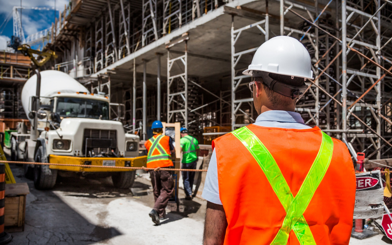 A man in a high-vis jacket at a construction site