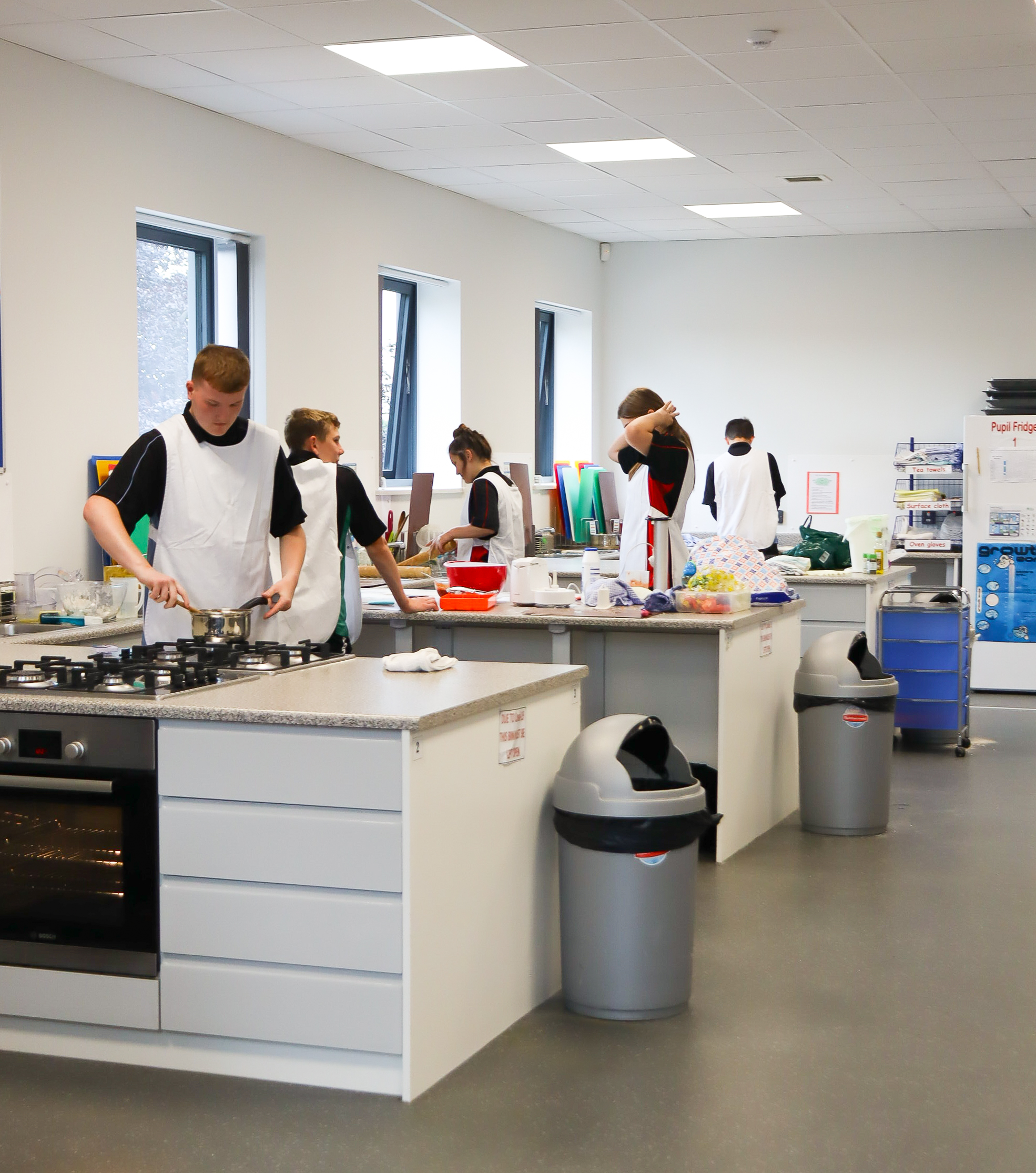 Pupils cooking in a Food Tech classroom
