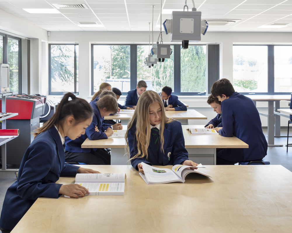 Students sitting at tables in a classroom